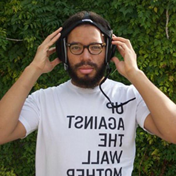 an African American male with headphones on