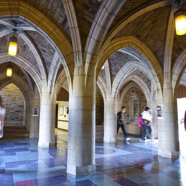 a Gothic cloister with stone archways